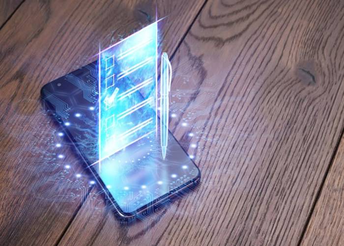 En illustrasjon av en mobiltelefon med et hologram for stemmeseddelen. (Foto: Marko Aliaksandr. Via Shutterstock)